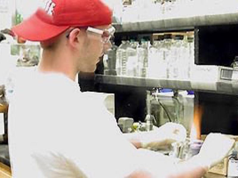 Chemistry student working in lab. Chemistry student working in lab.