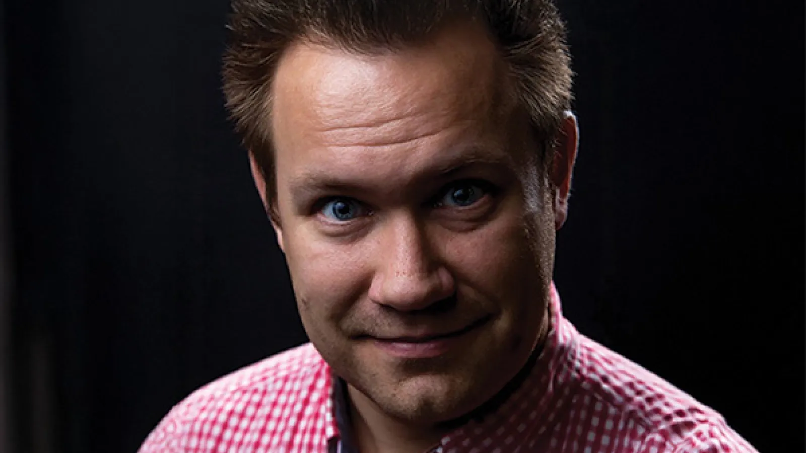 Smiling man posing for a headshot photo