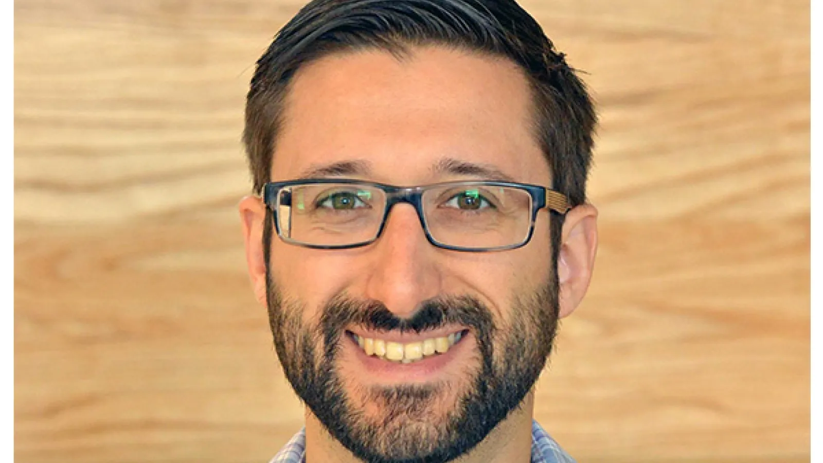 Smiling man wearing glasses