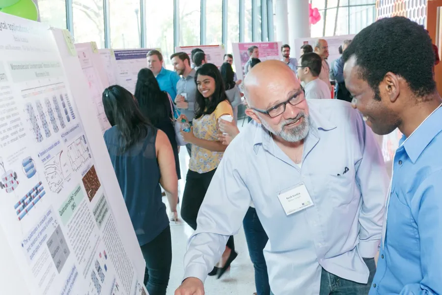 people looking at a poster