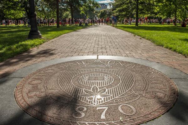Photograph of university seal on the Oval walkway