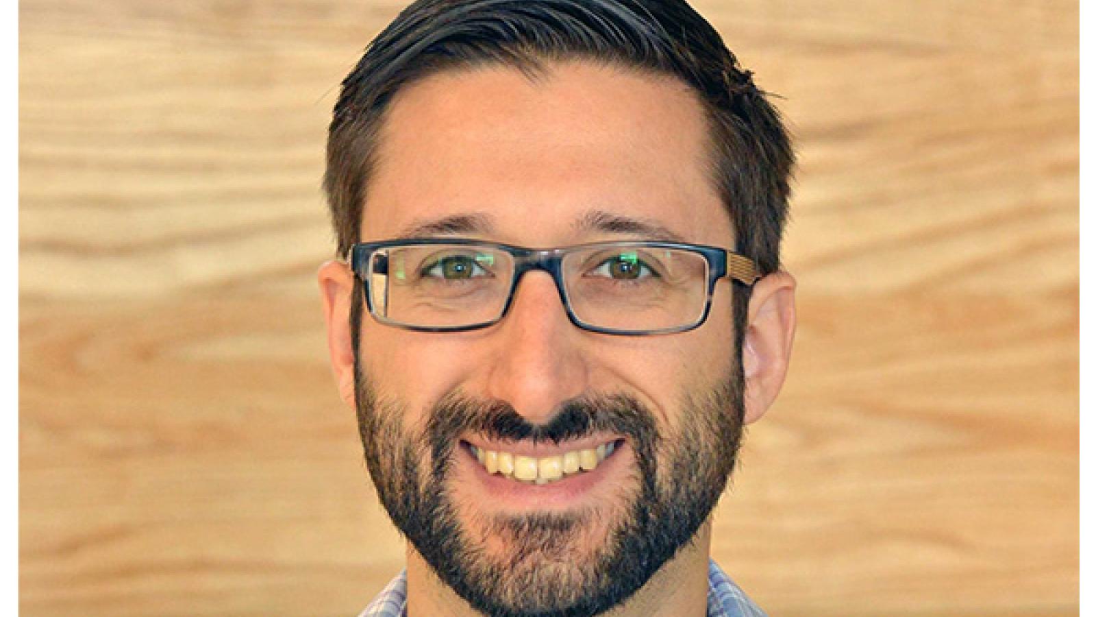 Smiling man wearing glasses