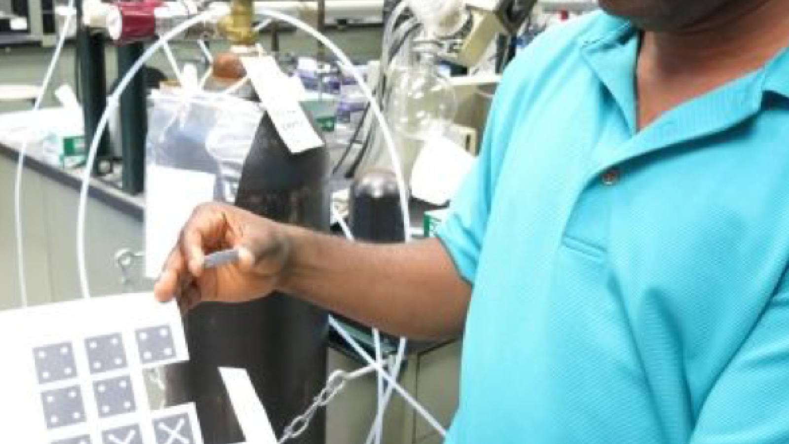 Dr. Badu-Tawiah displaying the test he created